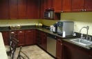 Kitchen stocked with complimentary snacks and beverages.